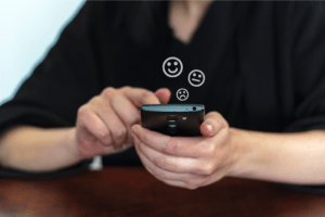 A picture of a person leaving reviews on their phone with different businesses