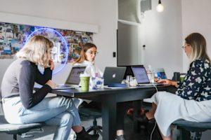 A picture of a marketing team working on their marketing strategy for their brand reputation.