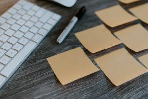 A desk with some sticky notes on it