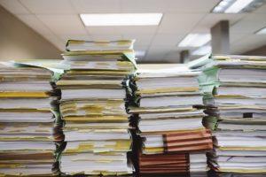 A picture of a pile of files and papers