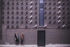 Two people being monitored by a bunch of cameras to see what their first impression is