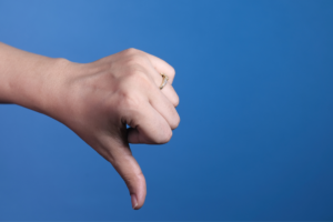 A picture of a thumbs down, signifying negative online reviews.