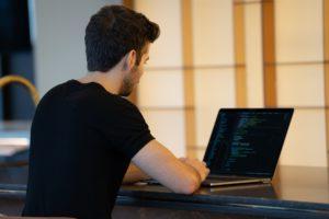 man working on improving website