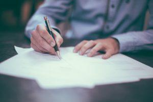 man writing report