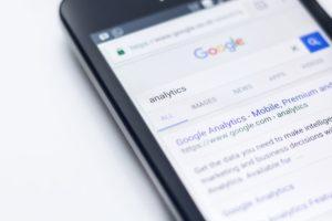 Picture of a phone googling a keyword